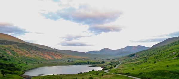 Scenic view of landscape and mountains against sky