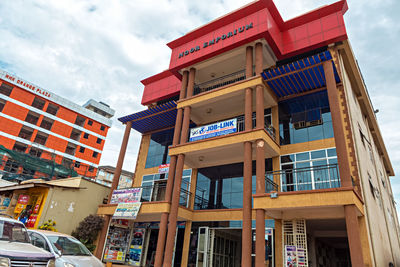 Low angle view of building against cloudy sky