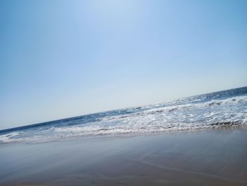 Scenic view of sea against clear blue sky