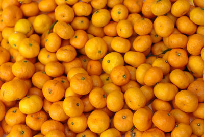 Full frame shot of oranges at market stall