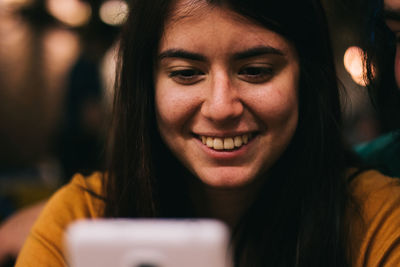 Close-up of smiling young woman