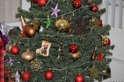 Close-up of christmas decoration hanging on tree at home