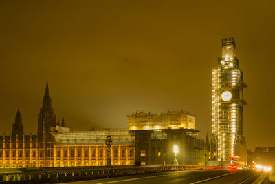 Illuminated buildings in city at night