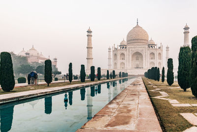 Taj mahal at foggy sunrise in winter