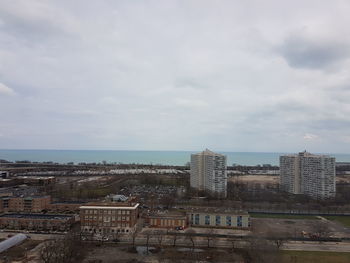 High angle view of city against cloudy sky