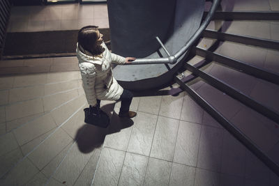 High angle view of woman walking on steps