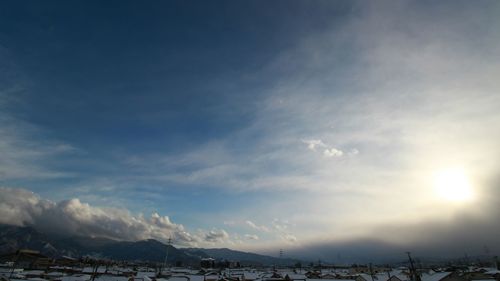 Scenic view of snow covered mountains against sky