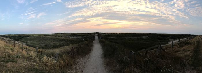 Scenic view of landscape against sky during sunset