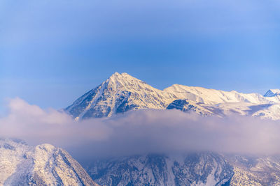 Scenic view of snowcapped mountains against sky