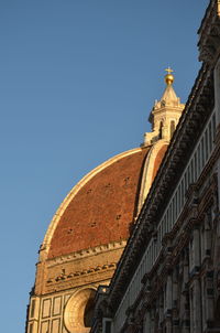 Low angle view of building against blue sky