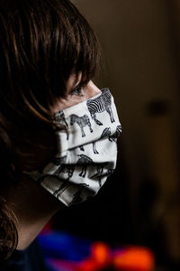 Close-up portrait of man wearing mask