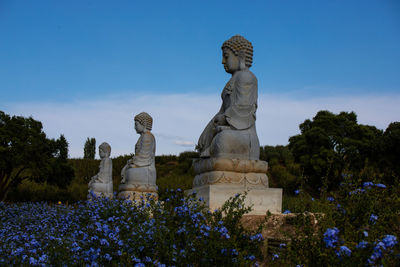 Statue against blue sky