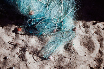 High angle view of fishing net at beach