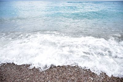 High angle view of surf on beach