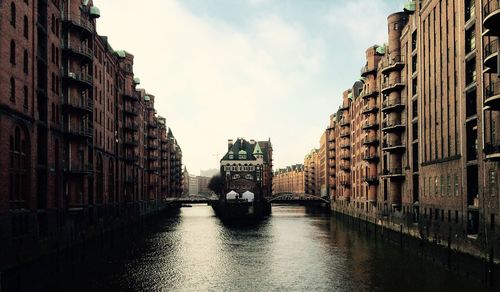 Buildings in canal along buildings