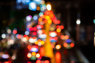 Defocused image of illuminated christmas lights at night