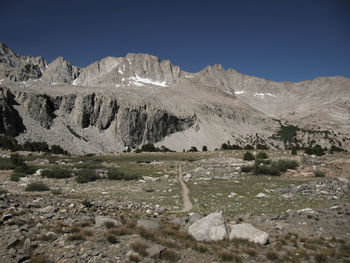 Scenic view of mountains against cloudy sky