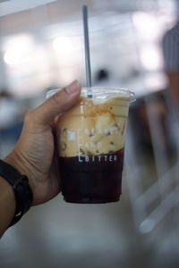 Close-up of hand holding ice cream