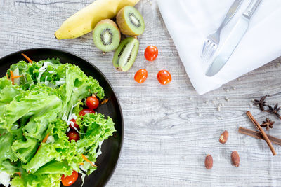 High angle view of chopped fruits in bowl on table