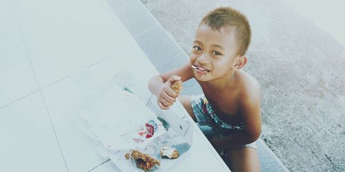 High angle portrait of shirtless boy