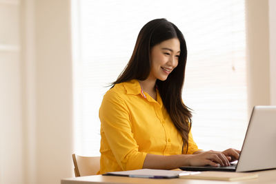 Young woman using smart phone