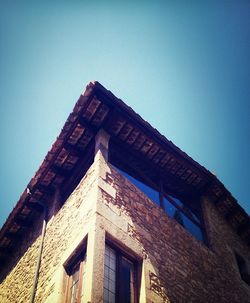 Low angle view of built structure against blue sky