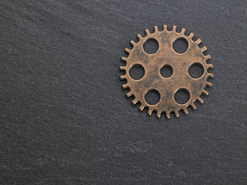 Close-up of gear on black table