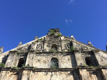 Low angle view of cathedral against blue sky