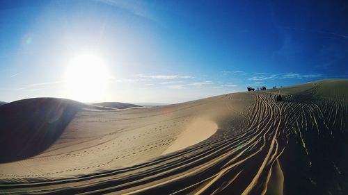 Panoramic view of desert against clear sky