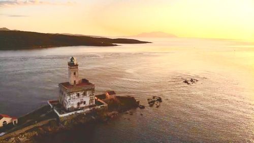 High angle view of beach against sky during sunset