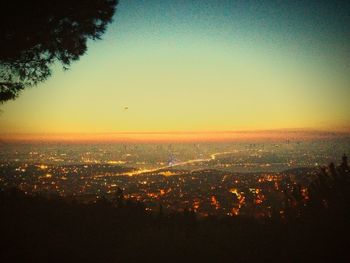 Scenic view of illuminated clear sky at sunset