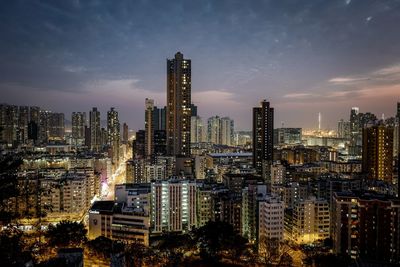 Aerial view of city lit up at night