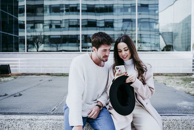 Young couple kissing in city