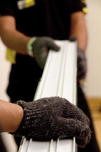 Close-up of coworkers working at construction site