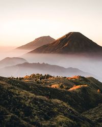 Scenic view of mountains against sky during sunset