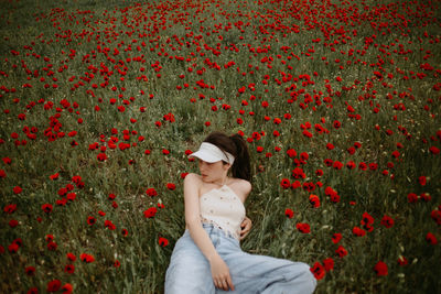 Young woman standing amidst plants