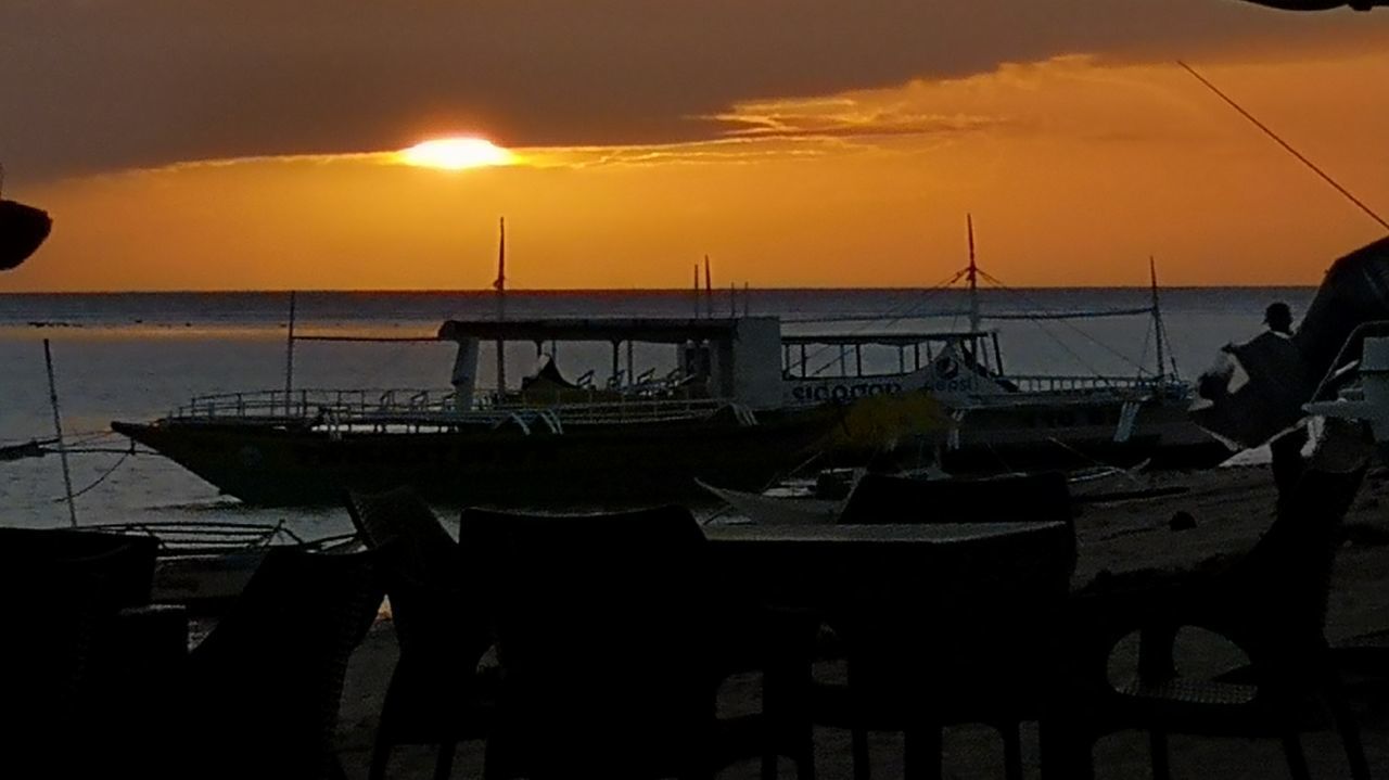 SCENIC VIEW OF SEA AGAINST ORANGE SKY