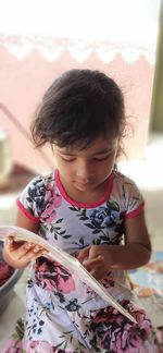 Girl holding book