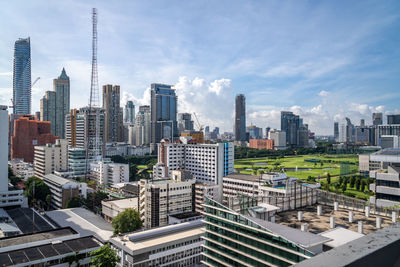 Bangkok, thailand - 12 august 2022 - view of bangkok cityscape high-rises and bts skytrains