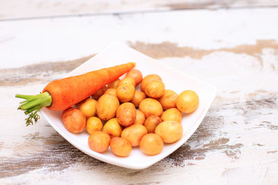 High angle view of fresh fruits in plate on table