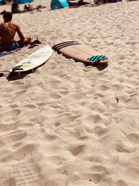 Low section of people playing on sand at beach