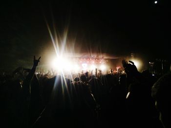 Silhouette people enjoying music concert