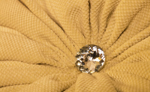 High angle view of diamond on fabric