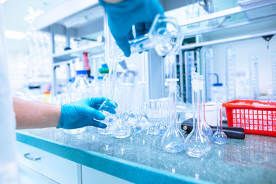 Cropped hands of scientist experimenting at laboratory