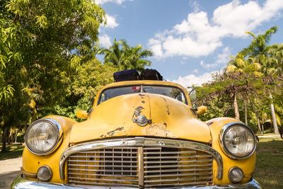 Close-up of vintage car parked on field