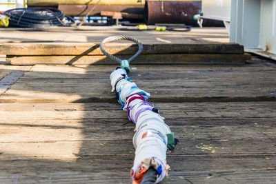 A wire rope laying on deck of a construction work barge at offshore oil field