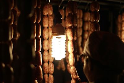 Close-up of light bulb hanging