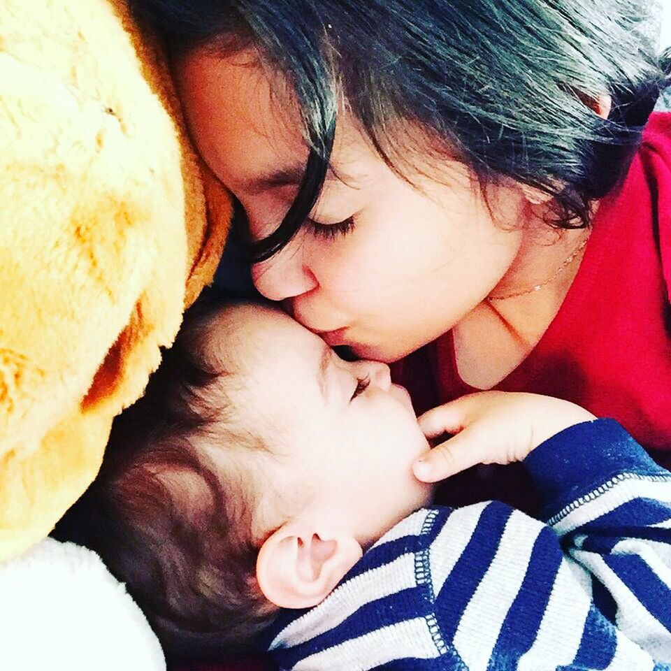 CLOSE-UP OF BABY GIRL SLEEPING IN BED