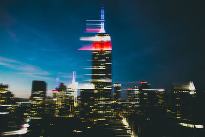 Illuminated buildings in city at night