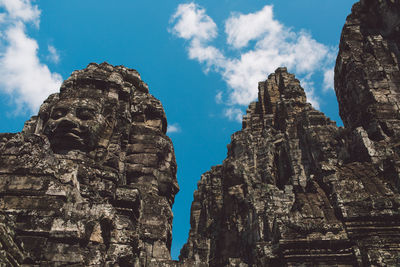 Low angle view of statue of temple against sky